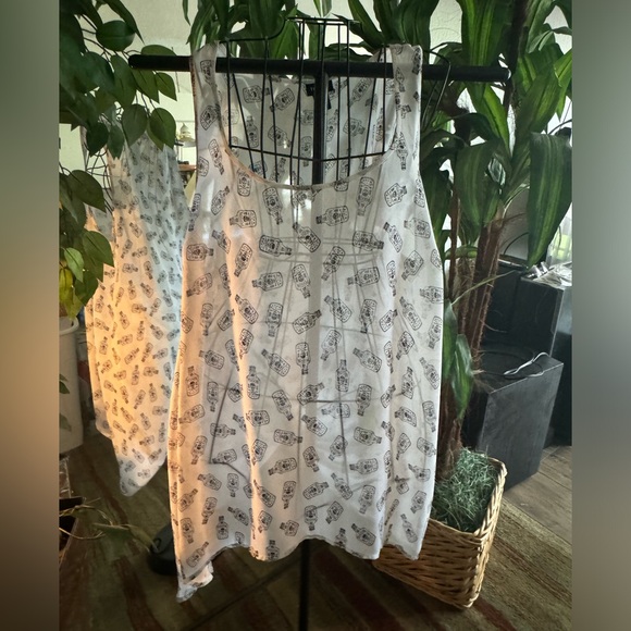 Torrid Hi-Lo Chiffon Skull/Poison Bottle Sleeveless Top - Picture 2 of 7